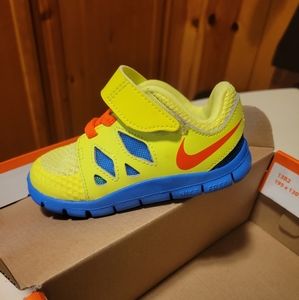 Nike Free 5 sneakers. Toddler size 6c. Neon yellow, orange, and blue